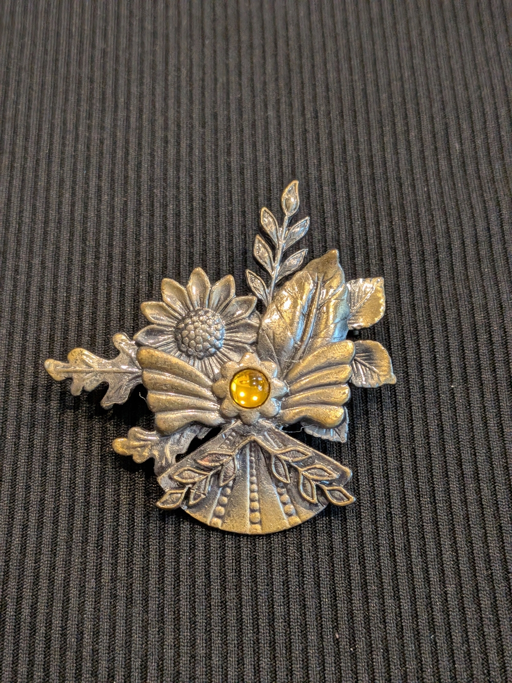 #1: Kenneth Cole Decorative Silver-Tone Floral Brooch with Amber Accent